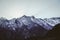 Snow capped massif mountain peaks in Karakoram range against clear blue sky at sunset. Gilgit Baltistan, Pakistan