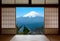 Snow capped Mount Fuji in Japan seen through traditional Japanese sliding paper doors