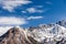 Snow-capped mountain peak, glacier against blue sky