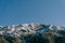 Snow-capped mountain peaks in Boka Kotorska. Winter in Montenegro in Kotor Bay.