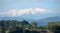 Snow capped mountain views over the Pyrenees with moody sky\\\'s overhead.