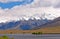 Snow Capped Mountains above a Remote Lake