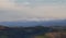 Snow-capped mountains of the Apennines and valleys illuminated by the winter sun