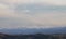 Snow-capped mountains of the Apennines and valleys illuminated by the winter sun