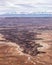 Snow Capped mountains in the distance behind Buck canyon - Canyonlands National Park.