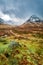 Snow capped mountains and a path in Glencoe