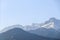 Snow-capped mountains of the Trans-Ili Alatau in the morning haze on a clear autumn day