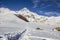 Snow-capped peak of Mount Kazbek, footpath, winter landscape