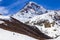 Snow-capped peak of Mount Kazbek, footpath, winter landscape