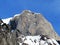 Snow-capped stone alpine peak Moor 2342 m in the Alpstein mountain range and in Appenzell Alps massif