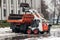 Snow cleaning machine on the streets of the city