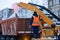 Snow cleaning tractor loading pile of snow on a dump truck. Isolate. Snow plow outdoors cleaning street city after