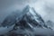 Snow cloaked mountain stands tall beneath a moody, overcast sky