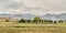 Snow clouds over foothills and farmland