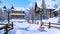 Snow covered alpine mountain town at winter day