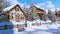 Snow covered alpine mountain village at winter day