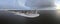 snow covered beach during wnter by Urk lighthouse in the Netherlands