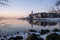 snow covered beach during wnter by Urk lighthouse in the Netherlands