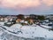 snow covered beach during wnter by Urk lighthouse in the Netherlands