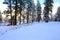 Snow covered beautiful old American rustic country side landscape with bridge, trail and water canal. Peaceful and inspiring