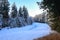 SNow covered beautiful old American rustic country side landscape with bridge, trail and water canal. Peaceful and inspiring