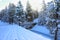 SNow covered beautiful old American rustic country side landscape with bridge, trail and water canal. Peaceful and inspiring