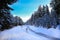 SNow covered beautiful old American rustic country side landscape with bridge, trail and water canal. Peaceful and inspiring