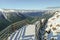 A snow covered boardwalk in the mountains