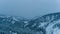 The snow covered Cascade Mountains at twilight in Washington State