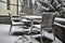 Snow-covered chairs