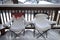 Snow-Covered Chairs on a Porch