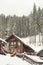 Snow covered chalet, winter background with copy space