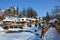 Snow-covered city park of the winter city on clear sunny day wit