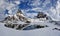 Snow-covered cliffs, reflecting in the lake