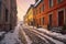 snow-covered cobblestone street in a quaint town