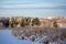 Snow covered cornfield, forest and farm in central Wisconsin in January