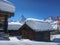 Snow covered cottages in front of Matterhorn mountain