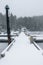 Snow covered dock and boats