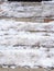 snow-covered doormats on outdoor steps of porch