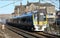 Snow covered electric train on WCML at Carnforth