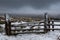 Snow covered fells of Cumbria as ominous looking clouds loom overhead