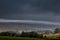 Snow covered fells of Cumbria as ominous looking clouds loom overhead