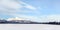 Snow covered field with Mount Krivan Slovak symbol in distance. Wide winter panorama with space for text