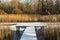 Snow covered footbridge on a small lake in the woods