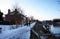 Snow covered footpath alongside the waterway at sundown. Feb  2021