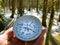 snow-covered forest, compass in hand