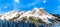 The snow covered granite rock face of Yak Peak in the Zopkios Ridge of the Cascade Mountain Range near the Coquihalla Summit