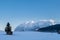 Snow covered hut on field with mountains Grimming, Schartenspitze, Steinfeldspitze