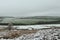 A snow covered landscape of the Moors in Durham in spring.