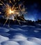 Snow covered landscape and sparkler - christmas